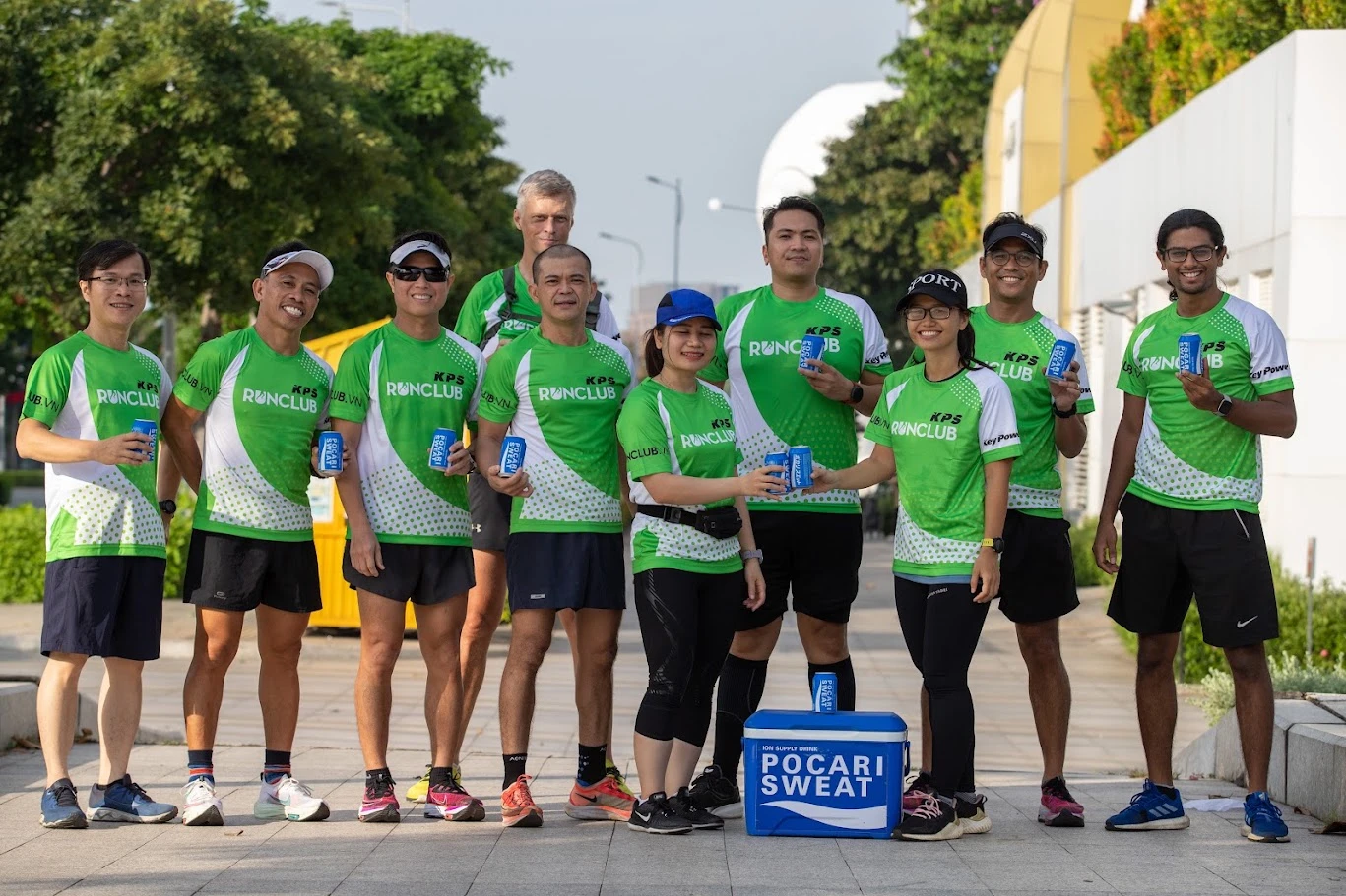 RUNCLUB runners in their green team shirts with Pocari Sweat